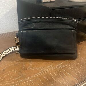 Black leather clutch, clean with no stains. Added strap w key ring